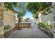 Gated front yard featuring a stone and stucco wall, small garden, and a view of the neighborhood street at 9485 Parkmoor Ave, Las Vegas, NV 89149