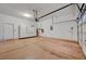 A spacious garage featuring sealed concrete floors and white walls with ample room for storage at 9485 Parkmoor Ave, Las Vegas, NV 89149