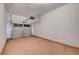 Spacious, unfinished two car garage with painted walls, and an automatic door opener at 9485 Parkmoor Ave, Las Vegas, NV 89149