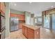 Spacious kitchen featuring stainless steel appliances and granite countertops at 9485 Parkmoor Ave, Las Vegas, NV 89149