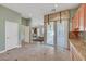 Bright kitchen featuring access to other rooms and granite countertops at 9485 Parkmoor Ave, Las Vegas, NV 89149