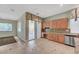 Spacious kitchen with granite countertops, stainless steel appliances, and access to backyard at 9485 Parkmoor Ave, Las Vegas, NV 89149
