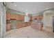 Well-lit kitchen featuring a center island, ample cabinetry, and modern appliances at 9485 Parkmoor Ave, Las Vegas, NV 89149
