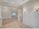 Spacious living room featuring carpet, arched doorways, decorative lighting, and neutral walls at 9485 Parkmoor Ave, Las Vegas, NV 89149