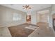 Bright living room with tile floors and view to kitchen and dining area at 9485 Parkmoor Ave, Las Vegas, NV 89149