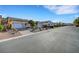 A charming home with a three-car garage and minimal landscaping in a quiet neighborhood at 9485 Parkmoor Ave, Las Vegas, NV 89149
