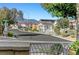 Street view of residential houses showcasing desert landscaping with mountains in the background at 9485 Parkmoor Ave, Las Vegas, NV 89149