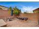 Brick-paved backyard with furniture and privacy wall at 1004 Bluebird Ridge Ct, North Las Vegas, NV 89084