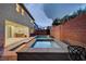A swimming pool and jacuzzi create a backyard oasis for relaxing and entertaining at 1004 Bluebird Ridge Ct, North Las Vegas, NV 89084
