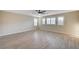 Spacious bedroom featuring light wood floors, modern ceiling fan and plantation shutters for ample natural light at 1004 Bluebird Ridge Ct, North Las Vegas, NV 89084