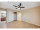 Bedroom featuring wood-style floors, neutral paint, and a ceiling fan with a walk-in closet at 1004 Bluebird Ridge Ct, North Las Vegas, NV 89084