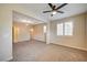 Spacious bonus room featuring neutral paint, plush carpet, and plenty of natural light at 1004 Bluebird Ridge Ct, North Las Vegas, NV 89084