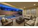 An inviting covered patio features comfortable seating, a view of the pool, and a peaceful outdoor living space at 1004 Bluebird Ridge Ct, North Las Vegas, NV 89084