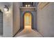 Inviting front entrance with a decorative archway and a stylish, light blue front door at 1004 Bluebird Ridge Ct, North Las Vegas, NV 89084