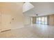 Open and airy living room with vaulted ceilings and view to the patio and pool area at 1004 Bluebird Ridge Ct, North Las Vegas, NV 89084