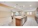 Bright living room offers a kitchen view, with a seamless flow to the outdoor patio and pool at 1004 Bluebird Ridge Ct, North Las Vegas, NV 89084