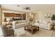 Bright, inviting living room with neutral colors and ample space, adjacent to the kitchen at 1004 Bluebird Ridge Ct, North Las Vegas, NV 89084