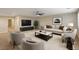 Spacious living room featuring neutral paint, stylish furniture, and a ceiling fan at 1004 Bluebird Ridge Ct, North Las Vegas, NV 89084