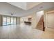 Spacious living area offering access to the pool, stairs to the second floor, and an open kitchen area at 1004 Bluebird Ridge Ct, North Las Vegas, NV 89084