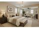 Serene main bedroom with a seating area and a chandelier at 1004 Bluebird Ridge Ct, North Las Vegas, NV 89084