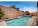 Backyard featuring a pool and spa and tall privacy wall at 1004 Bluebird Ridge Ct, North Las Vegas, NV 89084
