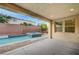 Covered outdoor patio featuring a pool and spa at 1004 Bluebird Ridge Ct, North Las Vegas, NV 89084