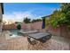 Backyard features a pool, spa, patio furniture, and privacy wall at 1004 Bluebird Ridge Ct, North Las Vegas, NV 89084