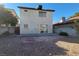 The backyard features a stone patio, gravel landscaping and block wall at 1016 Vantage Point Rd, Las Vegas, NV 89128