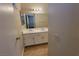 Bathroom featuring a double sink vanity, tile floors, and a large mirror at 1016 Vantage Point Rd, Las Vegas, NV 89128