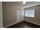 This bedroom features hardwood floors, a closet, and a large window at 1016 Vantage Point Rd, Las Vegas, NV 89128