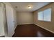Bedroom with hardwood floors, a window and a neutral wall paint color at 1016 Vantage Point Rd, Las Vegas, NV 89128