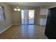 Bright dining area with a sliding glass door to backyard and a modern lighting fixture at 1016 Vantage Point Rd, Las Vegas, NV 89128