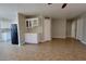 Open living area adjacent to kitchen featuring tile floors, neutral paint, and lots of natural light at 1016 Vantage Point Rd, Las Vegas, NV 89128