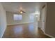 Bright living area with large windows, tile flooring, and a ceiling fan fixture at 1016 Vantage Point Rd, Las Vegas, NV 89128