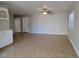 Spacious living room with neutral paint, tile flooring, and a modern ceiling fan fixture at 1016 Vantage Point Rd, Las Vegas, NV 89128