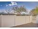 White fenced backyard with gravel landscaping provides a secure and private outdoor space at 1595 Lefty Garcia Way, Henderson, NV 89002