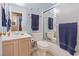 Well-maintained bathroom featuring a shower over tub, a single vanity, and matching blue-colored towels at 2040 Willowbury Dr # A, Las Vegas, NV 89108