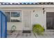 Close up of front entrance, featuring security door, leafy plant, and house number at 2040 Willowbury Dr # A, Las Vegas, NV 89108