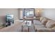 Comfortable living room with plush carpeting, comfortable seating, and natural light at 2040 Willowbury Dr # A, Las Vegas, NV 89108