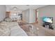 Open concept living area leading to the kitchen. Comfortable seating, and natural light at 2040 Willowbury Dr # A, Las Vegas, NV 89108