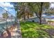 Well-maintained tennis court in a community setting with lush greenery and walking path at 2040 Willowbury Dr # A, Las Vegas, NV 89108
