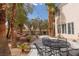 Inviting backyard with a patio, mature trees, and professional landscaping, perfect for entertaining at 21 Ocean Harbour Ln, Las Vegas, NV 89148
