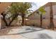 Expansive backyard features a stone patio, mature trees, and a private outdoor space for entertaining at 21 Ocean Harbour Ln, Las Vegas, NV 89148
