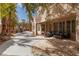 Beautiful backyard with a patio, mature trees, and landscaping, providing a serene outdoor escape at 21 Ocean Harbour Ln, Las Vegas, NV 89148