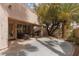 Spacious backyard with a covered patio, mature trees, and an outdoor kitchen for relaxed outdoor living at 21 Ocean Harbour Ln, Las Vegas, NV 89148