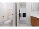 A bathroom with a toilet, a tub, and an open door to the adjacent bedroom at 21 Ocean Harbour Ln, Las Vegas, NV 89148