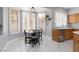 Bright breakfast nook with windows, tile floor, light walls and access to the kitchen at 21 Ocean Harbour Ln, Las Vegas, NV 89148