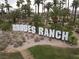 Rhodes Ranch community sign surrounded by lush landscaping, creating a welcoming entrance and setting at 21 Ocean Harbour Ln, Las Vegas, NV 89148