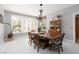 Elegant dining room with chandelier, large windows, and ample seating for entertaining at 21 Ocean Harbour Ln, Las Vegas, NV 89148