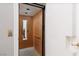 A residential elevator featuring a wood paneled interior with mirror and a metal control panel at 21 Ocean Harbour Ln, Las Vegas, NV 89148
